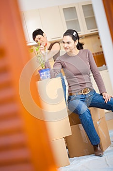 Woman sittin on cardboard box