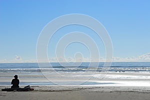 Woman Sitting alone at Beach