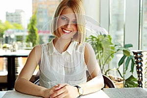 Woman sitting alone in cafe