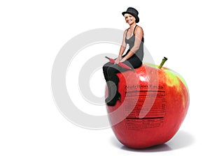 Woman Sitting on an Apple photo