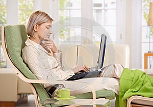 Woman working with computer at home