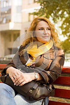 Woman sitting on bench resting after work