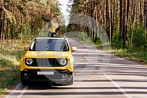 Woman Sitting on Car Sunroof Summer Road Trip