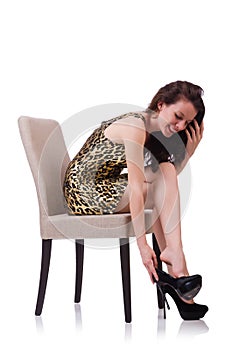 Woman sitting on chair isolated on white
