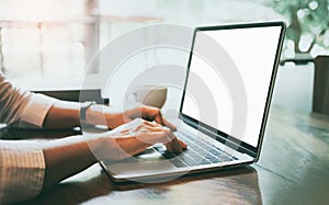 woman sitting the chair research course online website and studying learning on a mockup white screen laptop, e-learning