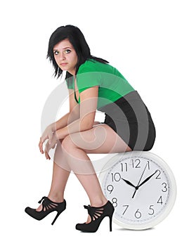 Woman sitting on clock