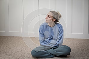 Woman sitting and contemplating life`s challenges