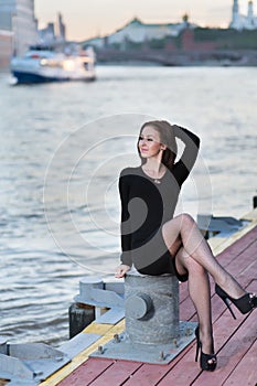 Woman is sitting cross-legged on device for mooring