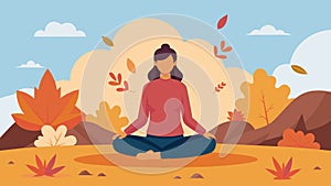 A woman sitting crosslegged on a large rock gazing at the colorful leaves while meditating in the crisp fall air photo