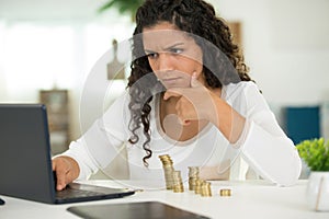 Woman sitting at desk with finantial problems