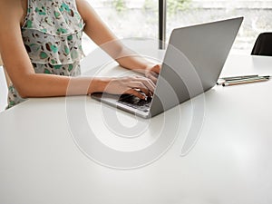 Woman sitting at desk and working at computer hands close up, Businesswoman typing on laptop at workplace Woman working in home
