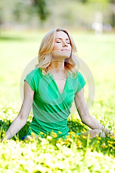 Woman sitting on grass