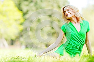 Woman sitting on grass