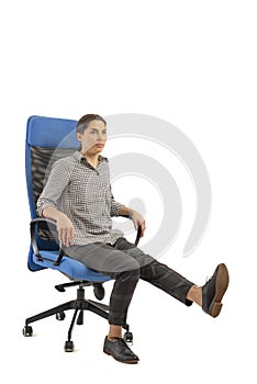 Woman sitting on her office chair and doing exercises