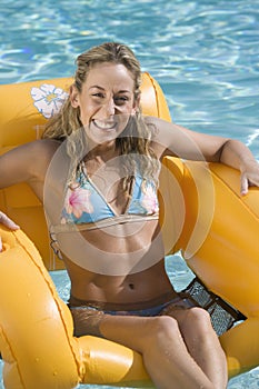Woman Sitting In An Inflatable Raft
