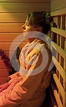 Woman sitting in an Infrared Sauna for relaxation