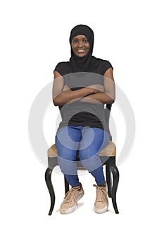 Woman sitting, isolated on white background