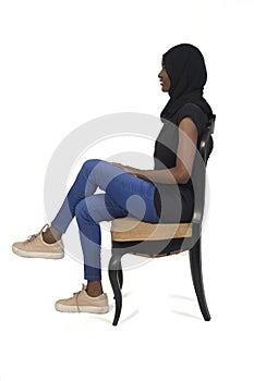 Woman sitting, isolated on white background
