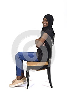 Woman sitting, isolated on white background