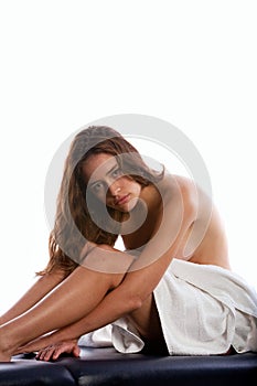 Woman sitting on massage table