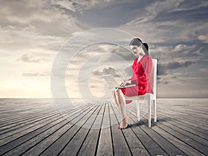 Woman sitting in the middle of nowhere