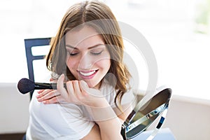 Woman sitting by the mirror