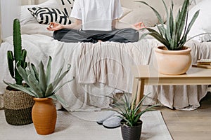 Woman sitting on morning meditation at home