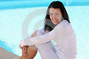 Woman sitting near the pool