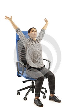 Woman sitting on the office chair and doing strech moves