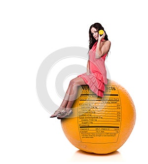Woman Sitting on Orange with Nutrition Label