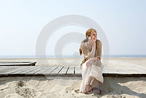 Woman sitting outdoors enjoying summer