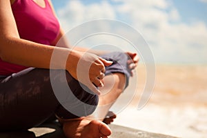 Woman sitting in relaxation yoga pose