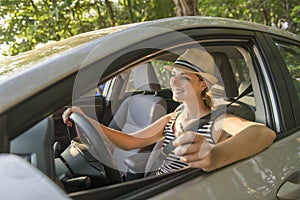 Woman sitting in a rental car on holiday vacancy