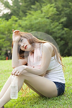 Woman sitting rest after exercise.