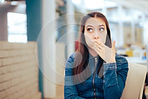 Woman Sitting in a Restaurant Feeling Sick and Nauseated