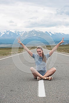 Woman sitting on the road