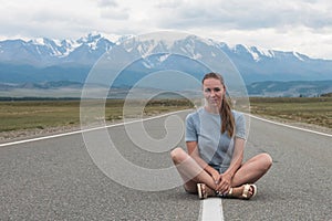 Woman sitting on the road