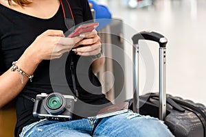 Woman sitting on seat at airport