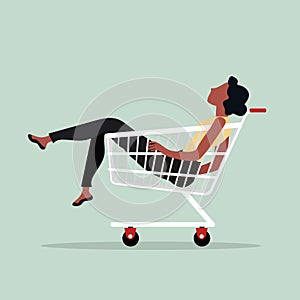 Woman sitting in shopping cart