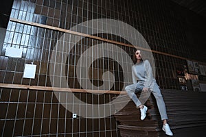 Woman sitting on some wood sheets