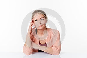 Woman sitting at sparse desk for patience and quietness