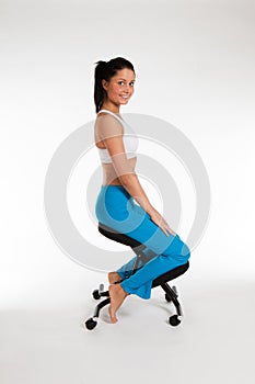 Woman sitting straigt on orthopedic chair