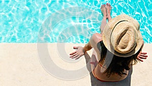 Woman sitting in a swimming pool