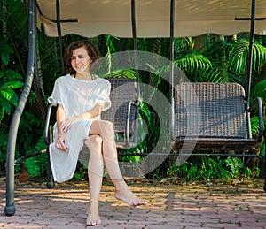 Woman sitting in swingset photo