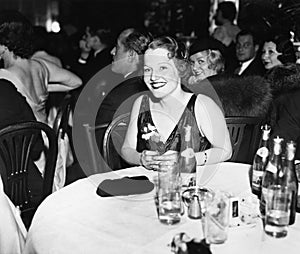 Woman sitting at a table in a club