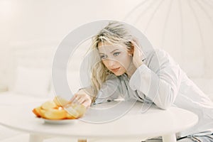 Woman Sitting at Table With Plate of Food
