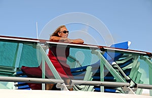 Woman Sitting on the Top Deck