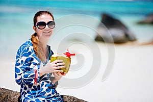 Woman sitting on top of granite rock