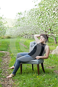 Woman Sitting in a Vintage Chair