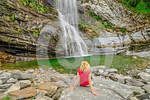 woman in great waterfall of Bignasco photo